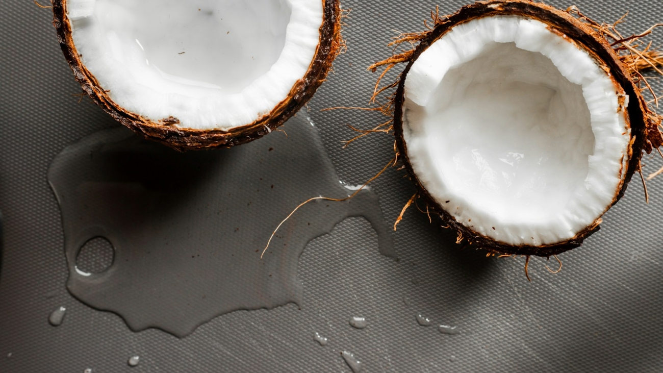 2 brown round food on black textile